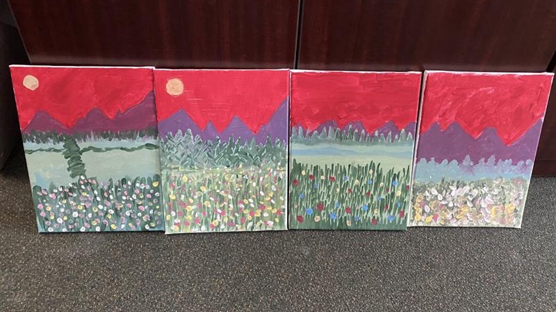 Four paintings of a mountain scene