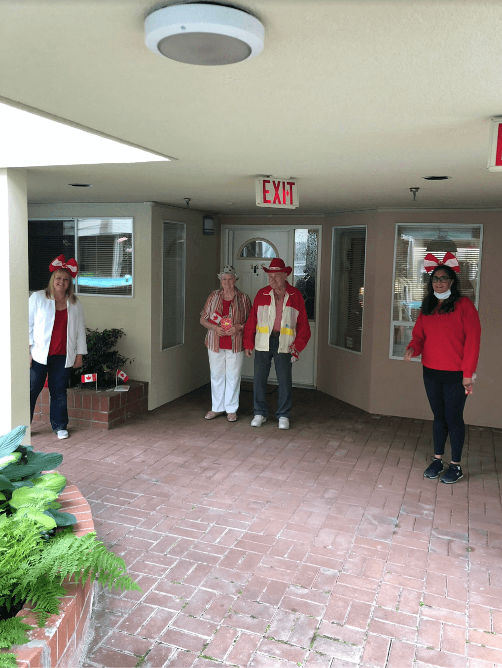 Maureen Fakaro and Gurpreet Pannu, the Community Relations team at Wisteria Place, with prospective residents celebrating Canada Day with physical distancing.