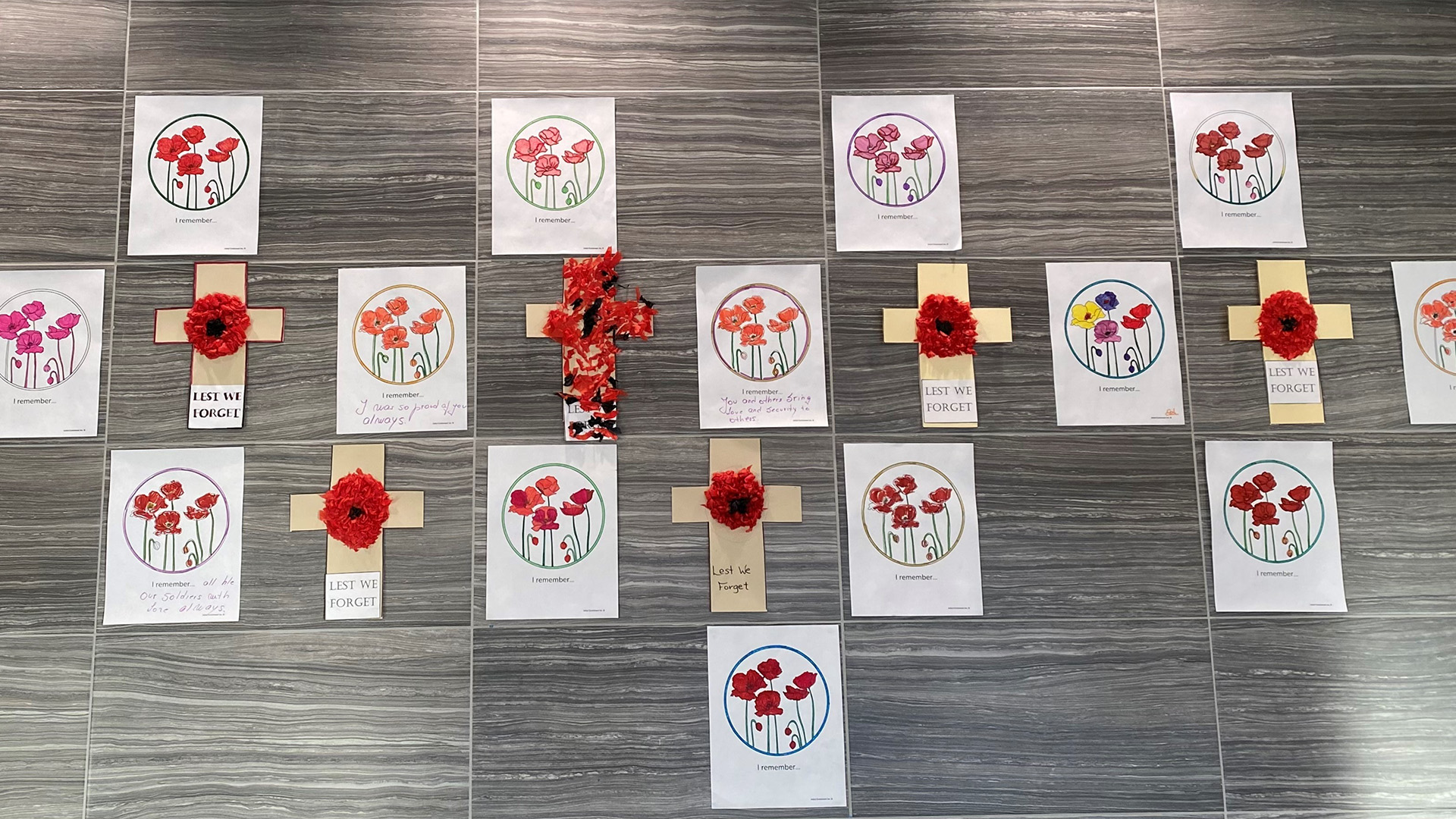 Remembrance Day art of crosses and coloured illustrations from residents.