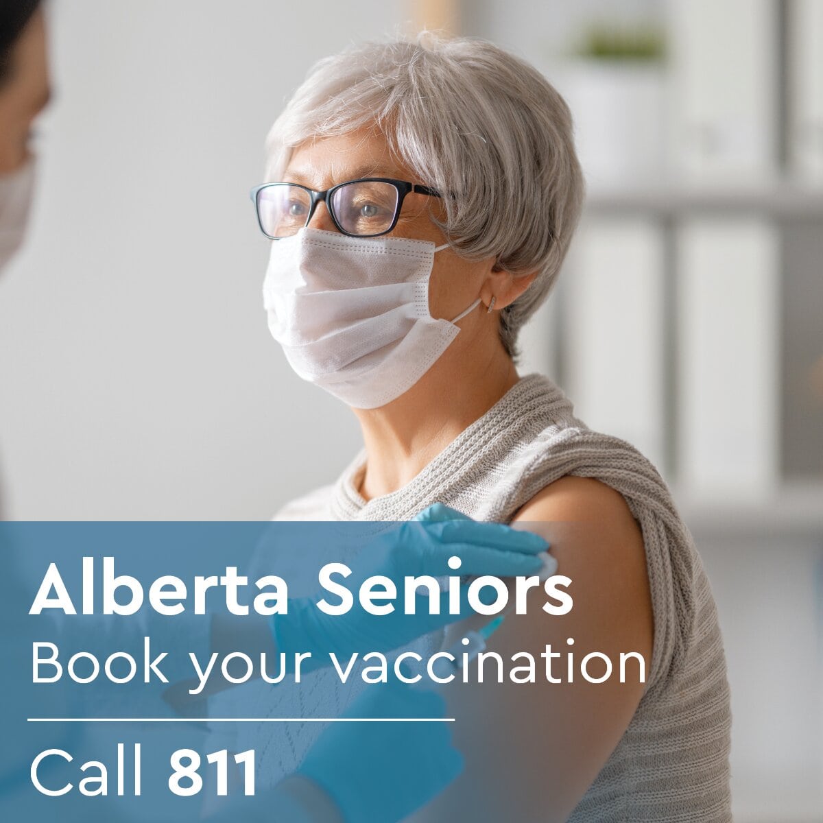A senior lady of Alberta taking vaccine