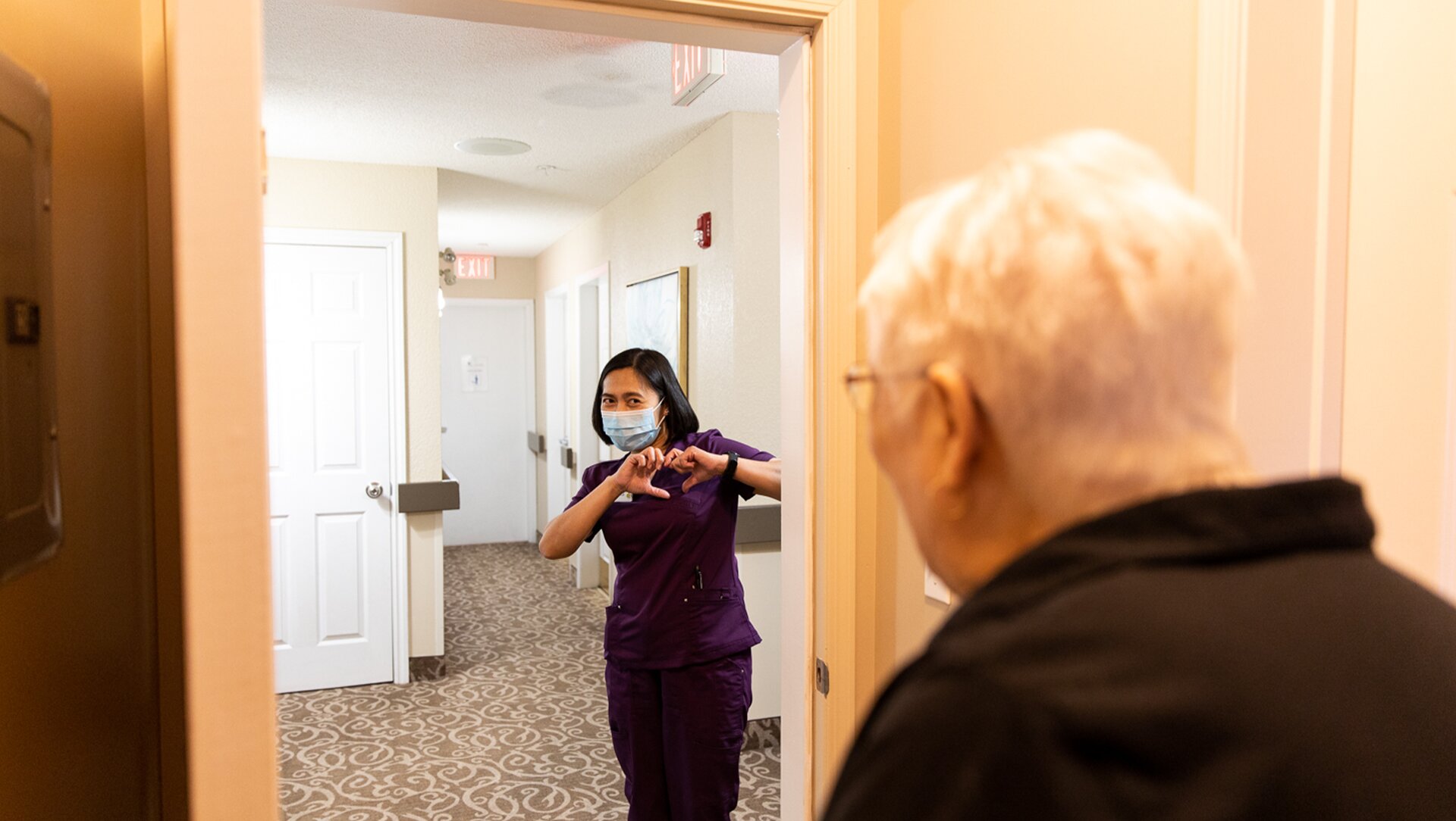 A nurse taking care of a senior citizen