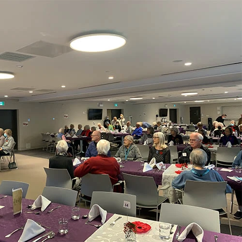 Another angle showing more of the room of Wisteria Place residents enjoying a Remembrance Day meal.