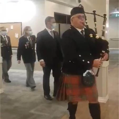 Bagpiper leading the way for Remembrance day.