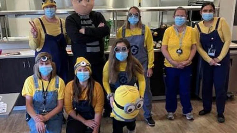 Staff dressed as minions and Gru from the movie Despicable Me.