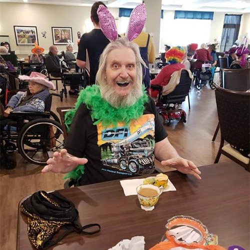 Resident looking excited while wearing a halloween costume of a bunny.