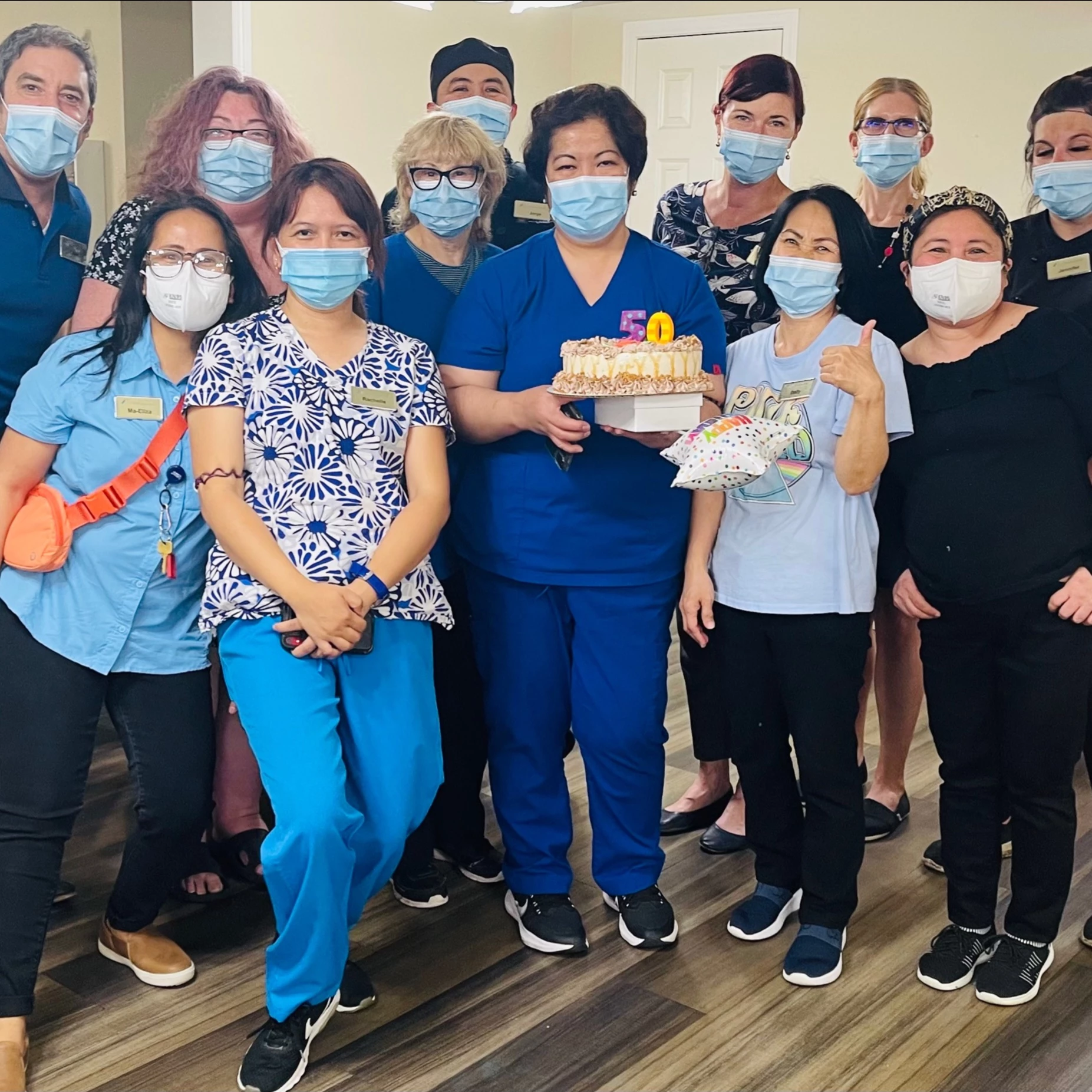 A group photo at optima's site on birthday party