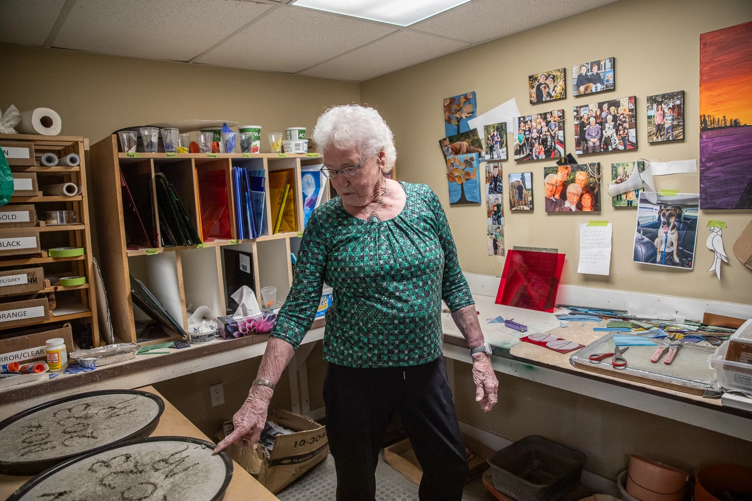 Nel pointing at one of her ongoing crafts