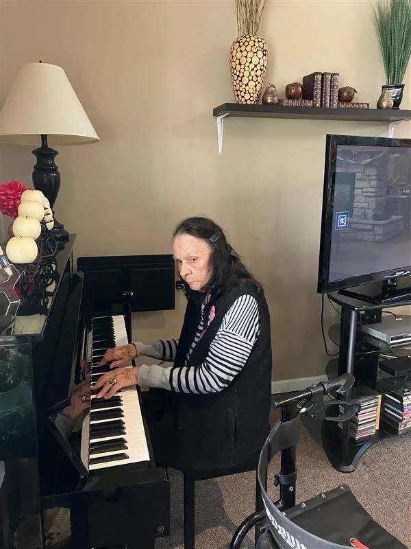 A senior playing the piano