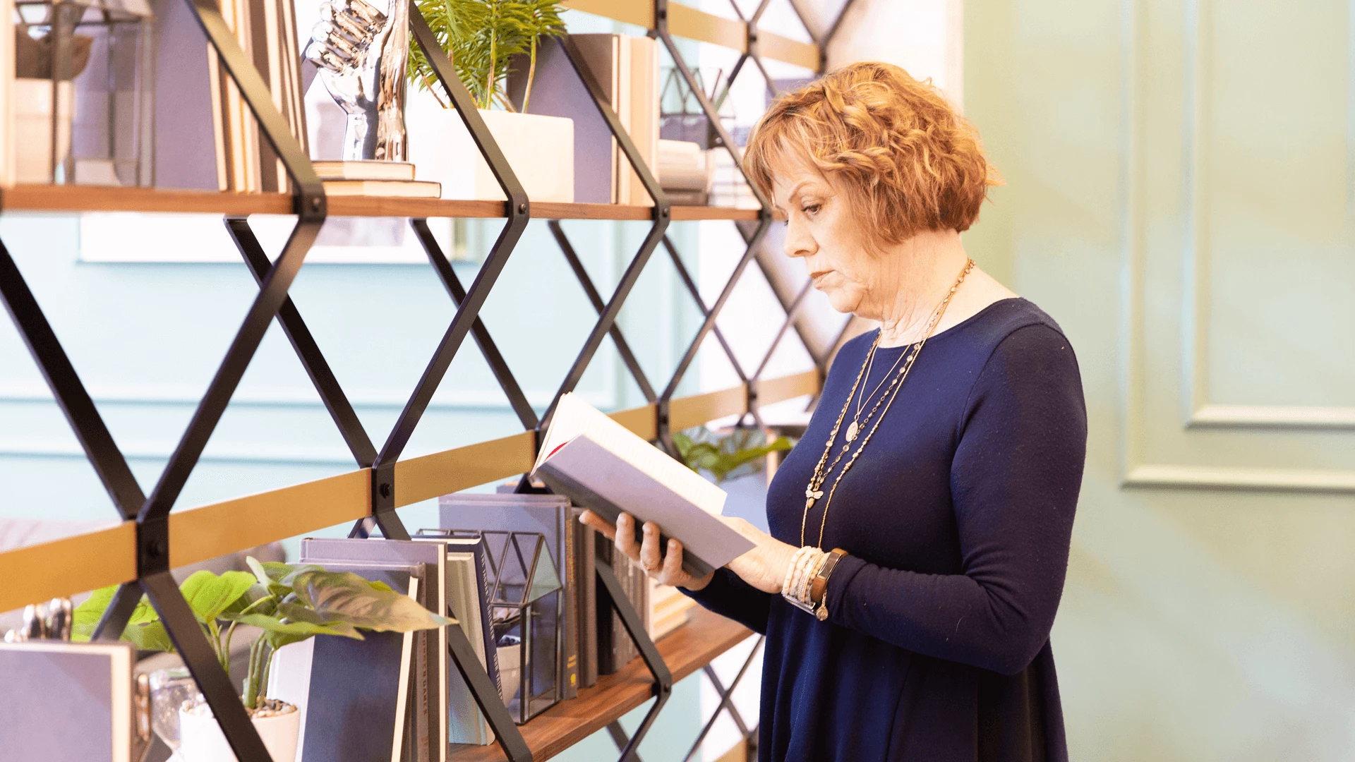 A woman looking through a book