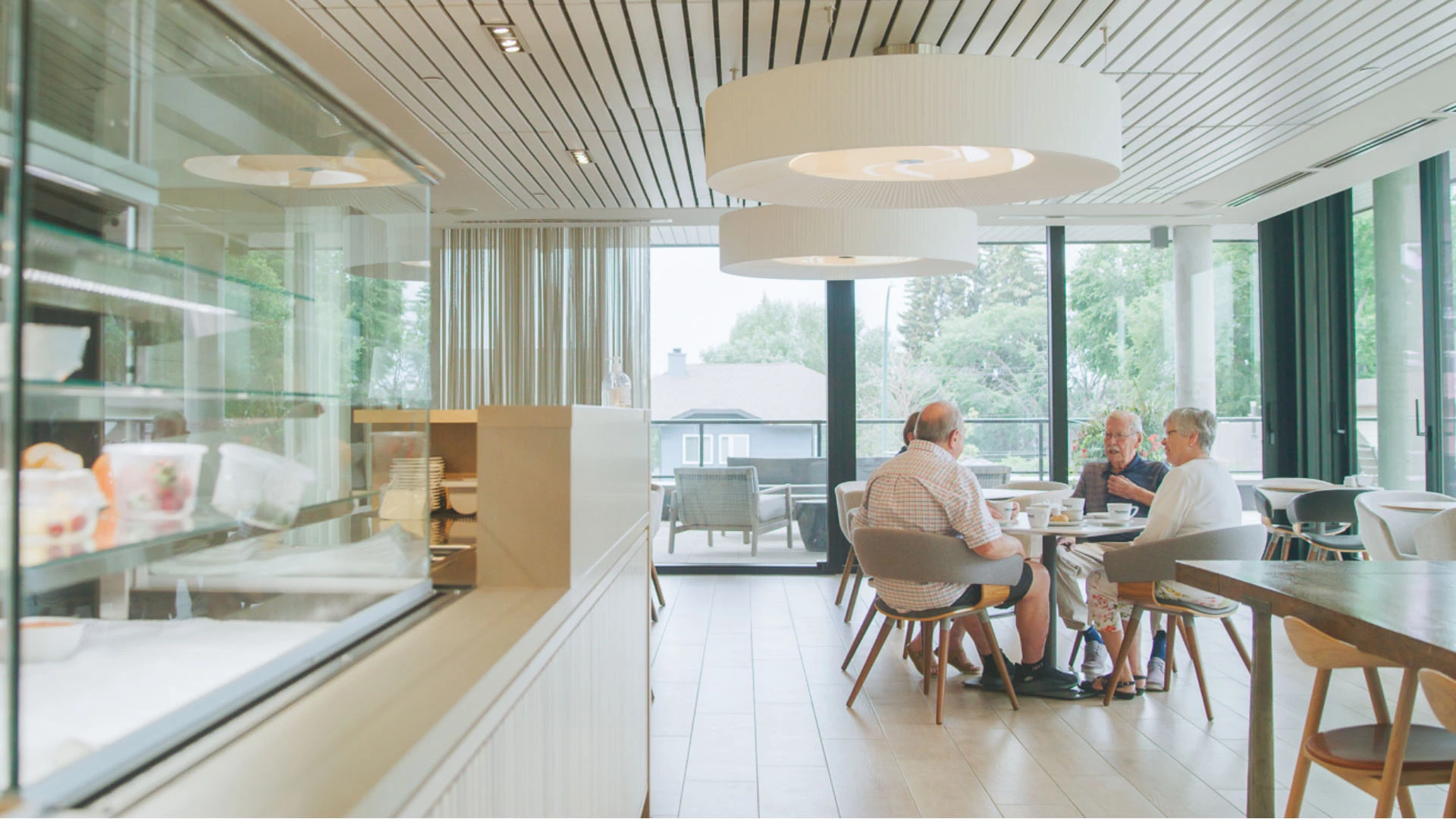 A group of seniors having coffee in a bistro