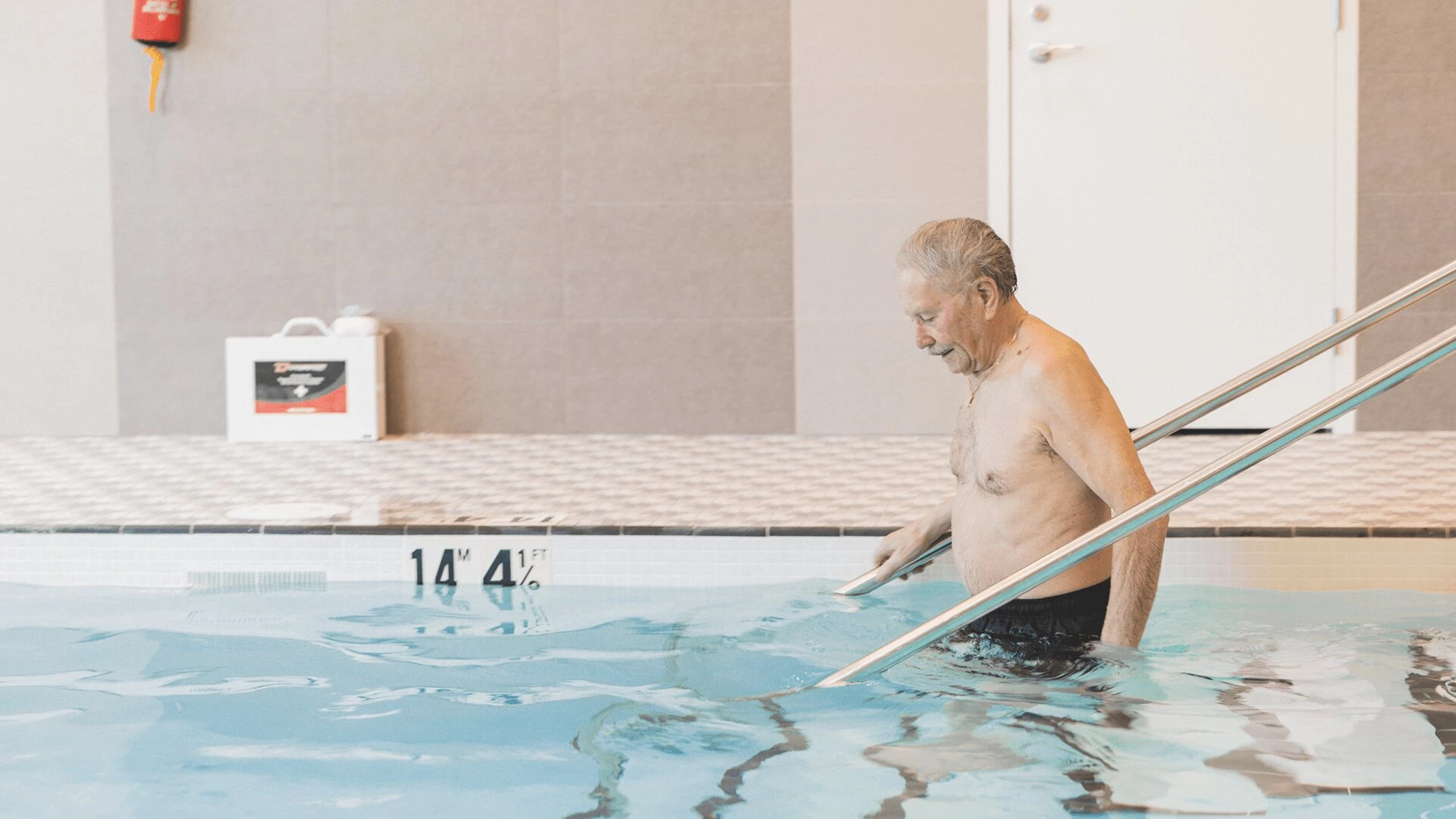 An elderly man while swimming at Wisteria Place senior home