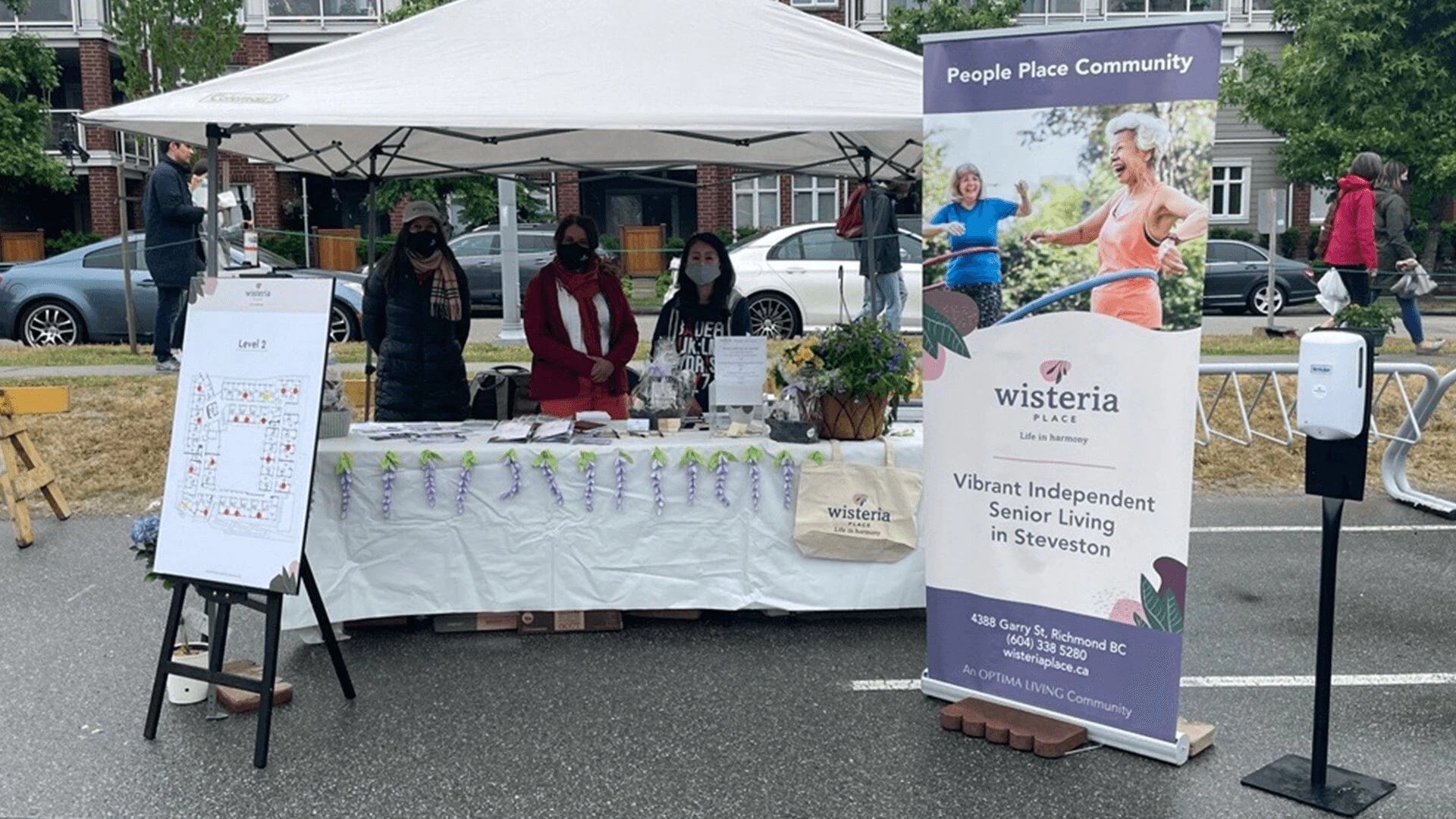 Steveston Farmers & Artisan Market August with Wisteria Place independent senior living booth