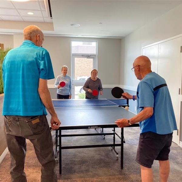 Some senior citizens playing table tennis