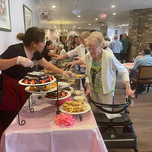 Seniors enjoying some treats at the wedding