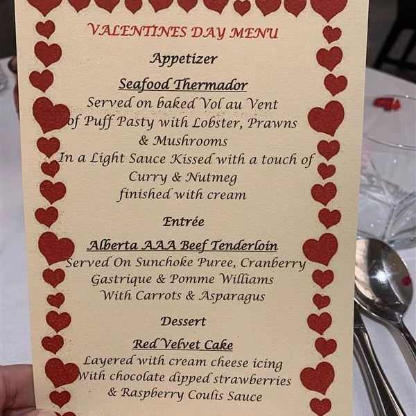 A menu for valentines day surrounded by a heart border