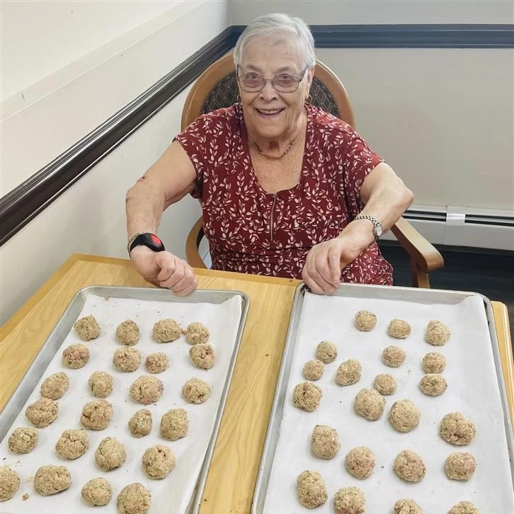 Senior enjoying cookies on a tray