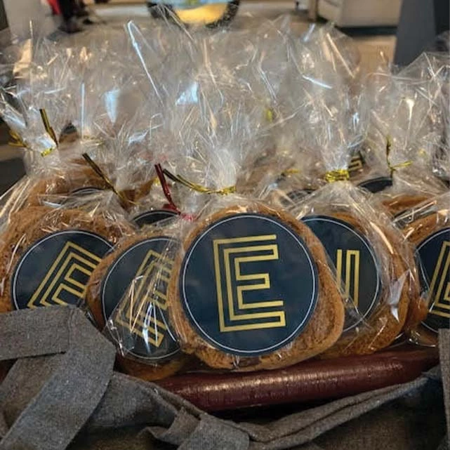 Cookies wrapped in plastic with the Edward icon stuck to each bag.